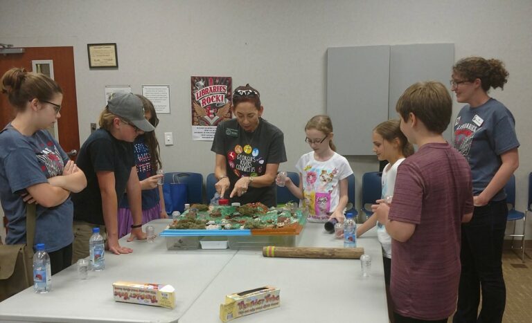 a volunteer educator leading a class at the Dawson County Library.