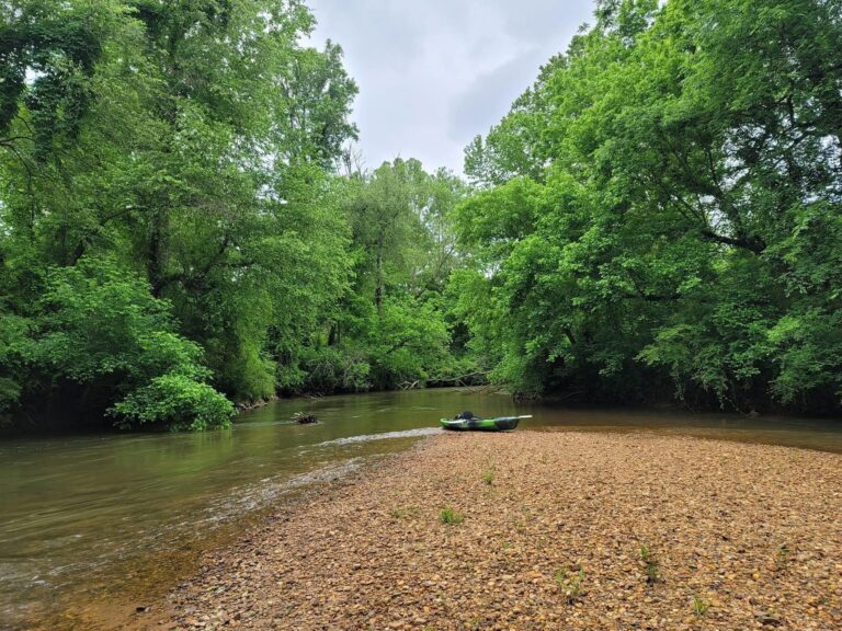 kayak sitting on a shoal at the confluence of the Etowah River and Yellow Creek.