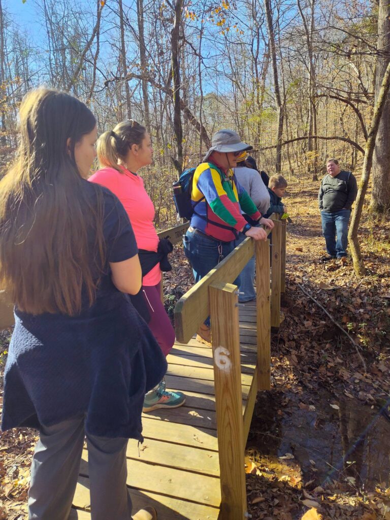 UERA guide leading a group on an educational hike